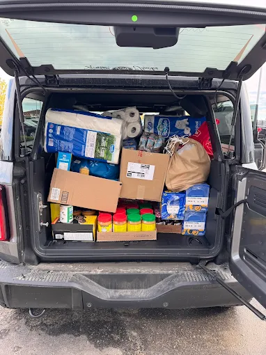 A Windsor Ford vehicle loaded with food-bank donations