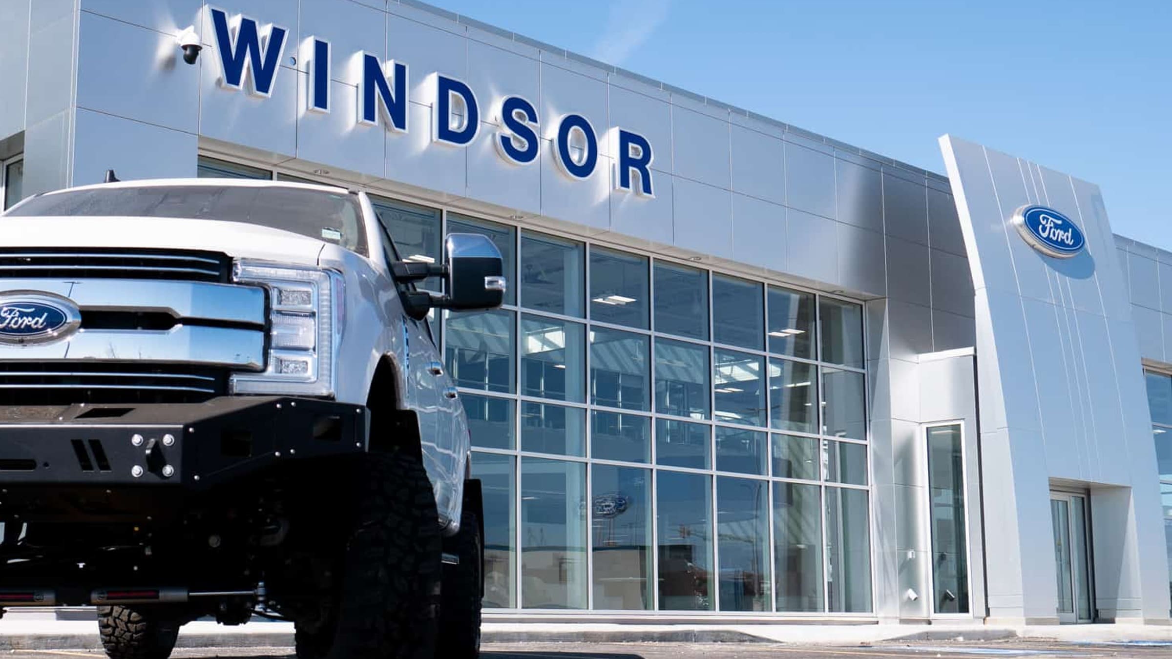 The Windsor Ford dealership in Grande Prairie, with a Ford Super Duty parked out front